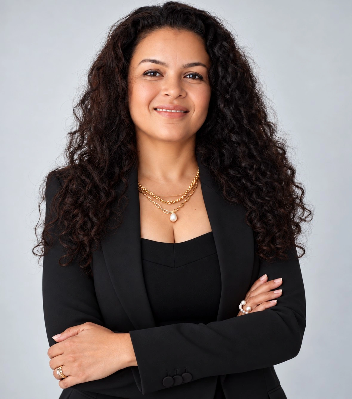 Bhargavi Patel wearing a black outfit, with her arms crossed